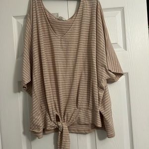 A woman’s to blouse never been used, but does not have tags